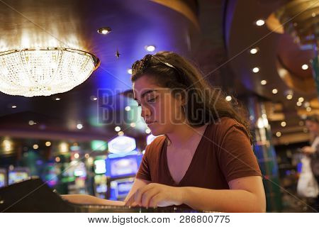 Beautiful Woman Playing Slot Machines With Nice Lights