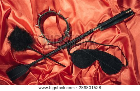 Bondage, Kinky Adult Sex Games, Kink And Bdsm Lifestyle Concept With A Whip, Feather Stick, Collar, 