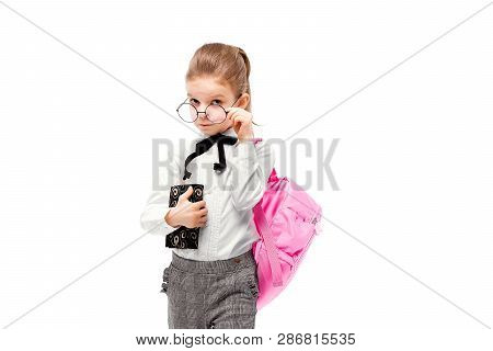 Back To School. Beautiful Little Girl Dressed Like A School Girl - In White Shirt And Gray Pants, Ro