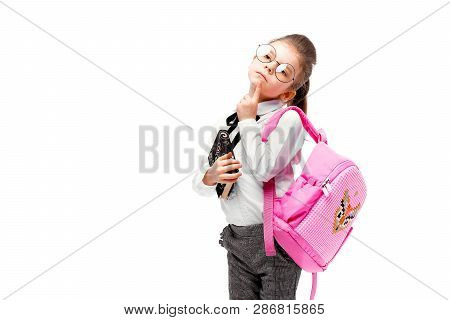 Back To School. Beautiful Little Girl Dressed Like A School Girl - In White Shirt And Gray Pants, Ro