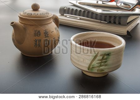 Chinese Tea Prepared To Drink To Relax From Working With Cameras, Glasses, Mobile Phones, Car Keys, 