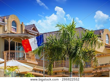 The French Flag Flying In Tropical Seaport Of Marigot, Saint Martin
