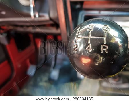 Car Shift Knob With Speed Numbers. Closeup Of A Car 5 Speed Gearstick.