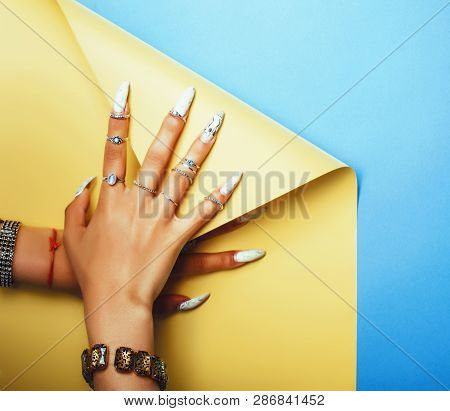 Woman Hands Holding Colorful Paper Copyspace Wearing A Lot Of Jewelry And Long Nails