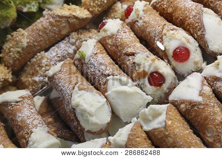 Background Of Stuffed Pastries Called Cannoli Siciliani In Italian Language. They Are The Typical Sw