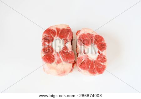 Fresh Cutting Raw Oxtail Or Beef With Bone, Tail Path Of Cow On White Plate And White Background. Ox