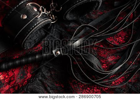Handcuffs And A Whip With Womens Sexy Underwear