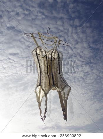 Dreams With Laces. Corseet In Vintages Style  From Around 1950 Flying On The Sky