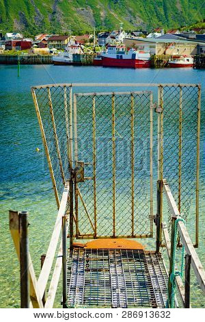 Fishing Port Old Pier And Gate With Bleik Village Houses In The Background. Andoya Island, Vesterale