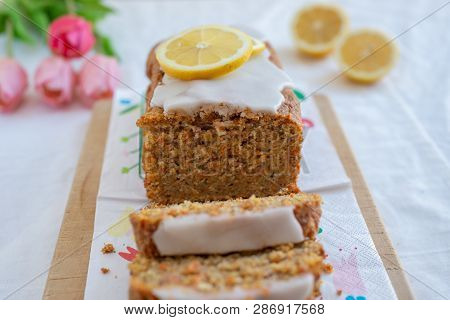 Home Made Carrot Cake With Lemon Frosting On The Table