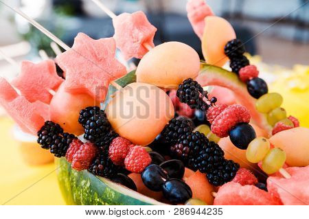 Watermelon Basket Filled With Fruit. Horizontal Photo