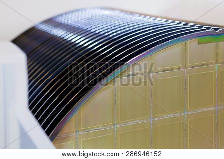 Silicon Wafers In White Plastic Holder Box On A Table- A Wafer Is A Thin Slice Of Semiconductor Mate