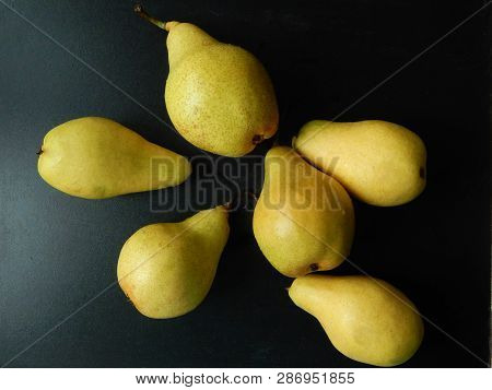 Ripe Pears On Black Background As A Low-calorie Source Of Folic And Organic Acids, Pectin, Carotene,