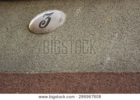 Wall With Number, Selective Focus And Several Colours