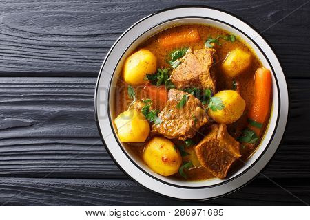 Namibia Potjiekos Traditional Lamb Dish With Vegetables Close-up In A Bowl. Horizontal Top View
