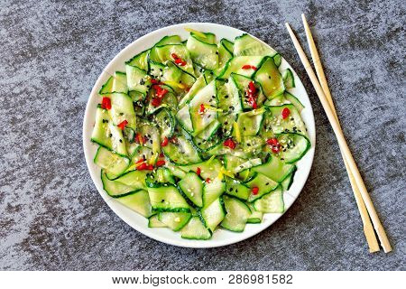 Cucumber Salad In Chinese Style. Salad With Cucumbers And Chili Pepper. Chinese Salad With Cucumber.