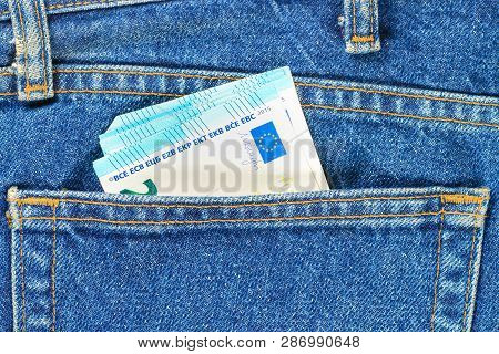 Several Bills Of Twenty Euros In The Back Pocket Of Jeans. Concept Of Absentminded Person, Potential