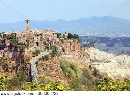 Incredible View Of A Village Perched On The Hill That Can Only Be Reached By A Narrow Pedestrian Bri