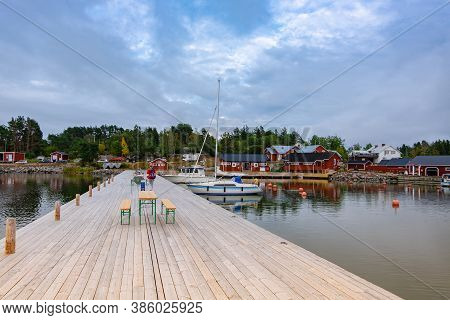 Finland, Aland Islands, Lappo, August - 2019: A Large Wooden Pier And A Beautiful View Of The Yachts