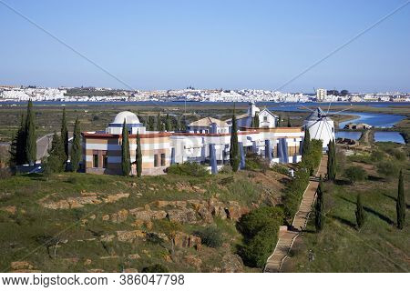 Windmill Of Castro Marim With Ayamonte And Guadiana River On The Foreground, In Portugal