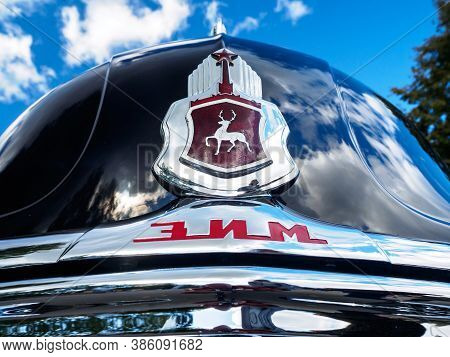 New Torial, Russia - September 12, 2020: Close-up View Of Gaz 12 Logo On Black Classic Vintage Car. 