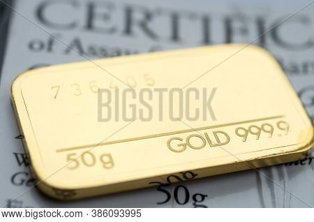 Minted Gold Bar Weighing 50 Grams 999.9, Fineness With Certificate. Gold Ingot With Assay Certificat
