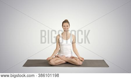 Relaxed Woman In Yoga Position Putting Hands Together And Medita