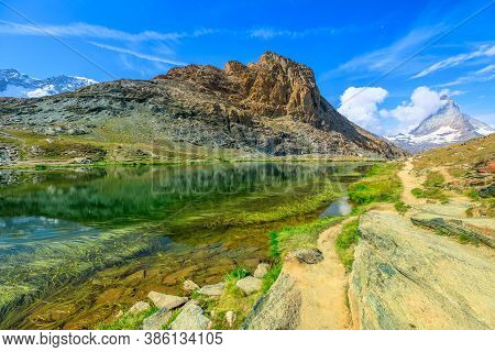 Riffelsee Lake With Mount Matterhorn Or Cervino And Swiss Alps. Zermatt, Canton Of Valais, Switzerla