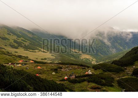 A Small Tent Town In The Mountains, Tents By The Lake In The Mountains, The Area Near The Lake Brebe