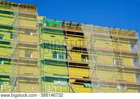 Scaffolding Arround The House To Install Thermal Insulation Of The Apartment Building Facade