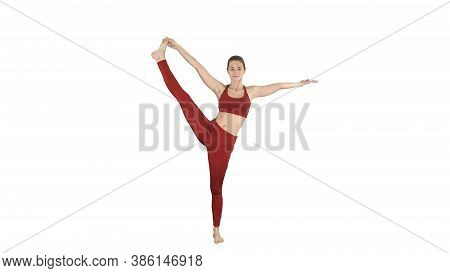Young Woman Practicing Yoga, Standing In Utthita Hasta Padangust