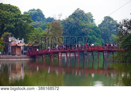 Hanoi, Vietnam - October 21, 2019 : Hanoi red bridge. The wooden red painted bridge over the Hoan Ki