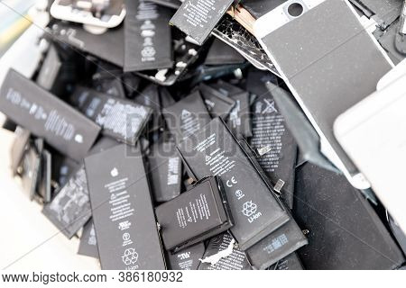 Russia - July 27, 2020: Broken Iphone Apple Phone Used Rechargeable Batteries In Recycling Chip Repa
