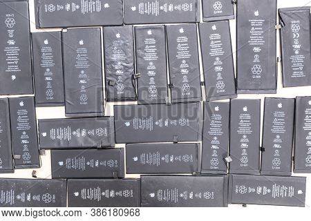 Russia - July 27, 2020: Broken Iphone Apple Phone Used Rechargeable Batteries In Recycling Chip Repa