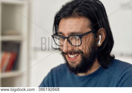 Close Up Portrait Of Happy Man Wearing Eyeglasses Teaching Online, Looking At Web Camera And Smiling