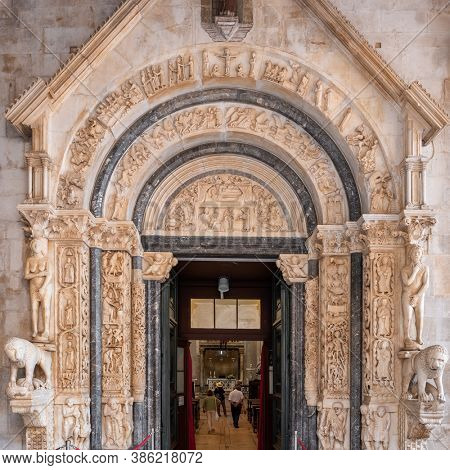 Trogir, Croatia - September 8, 2019: Radovan's portal of the St Lawrence cathedral church in Trogir, Croatia. Stone carving close up