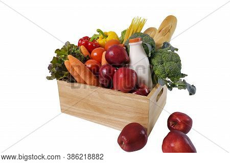 Wooden Crate With Multi Collor Vegetables , Fruit, Milk And Baguette Isolated On White Background. G