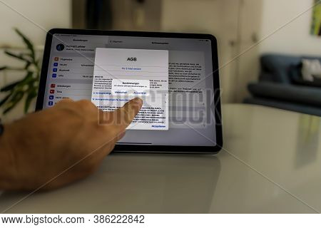 Frankfurt, Germany - September 17th 2020: A German Photographer Installing The All New Ipados 14 Sof