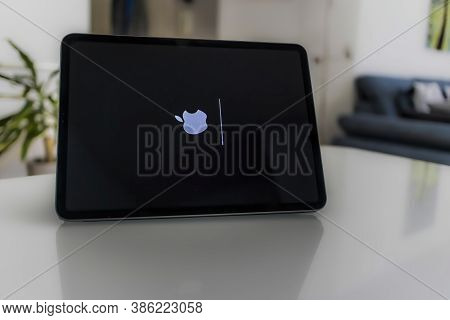 Frankfurt, Germany - September 17th 2020: A German Photographer Installing The All New Ipados 14 Sof