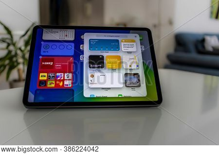 Frankfurt, Germany - September 17th 2020: A German Photographer Installing The All New Ipados 14 Sof