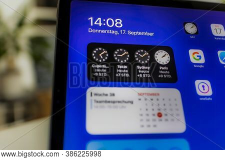 Frankfurt, Germany - September 17th 2020: A German Photographer Installing The All New Ipados 14 Sof