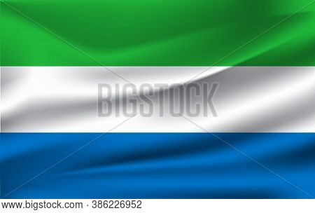 Flag Of Sierra Lrone. Realistic Waving Flag Of Sierra Lrone. Fabric Textured Flowing Flag Of Sierra 