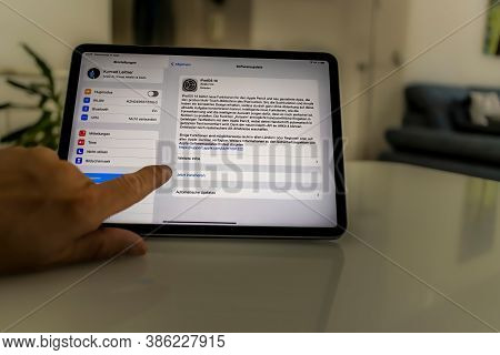 Frankfurt, Germany - September 17th 2020: A German Photographer Installing The All New Ipados 14 Sof
