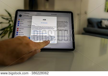 Frankfurt, Germany - September 17th 2020: A German Photographer Installing The All New Ipados 14 Sof