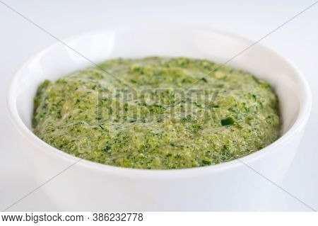 Hot Chili Pepper Paste. Green Sauce In The Ceramic Bowl Isolated On White Background. Adjika Or Ajik