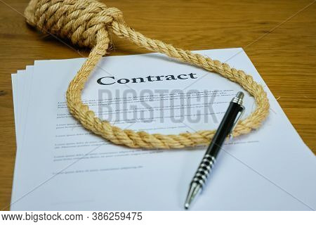 Contract With Pen And Rope Tied In Hangmans Noose. Strangulation Contract, Unfair Agreement. Lorum I