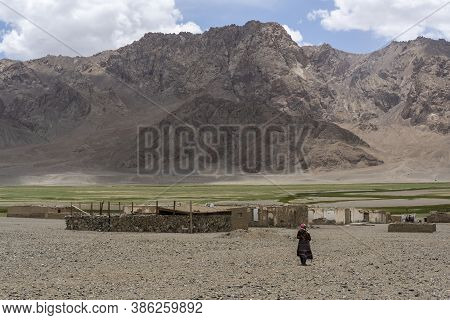 Murghab, Tajikistan - June 25, 2019: Old, Small Village Near Murghab With Abandoned Houses And A Lon
