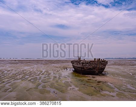 Old Wooden Barge Stranded At Low Tide In Naklua, Chonburi Province, Thailand.