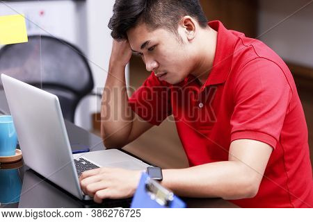 Tired Young Man Worke Rfrom Headache Or Migraine At Workplace. Male Employees Have Problems From Wor