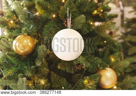 Christmas Tree And Decorations With Abstract Sparkling Lights.white Ball,stars In Tones.toned.toned 